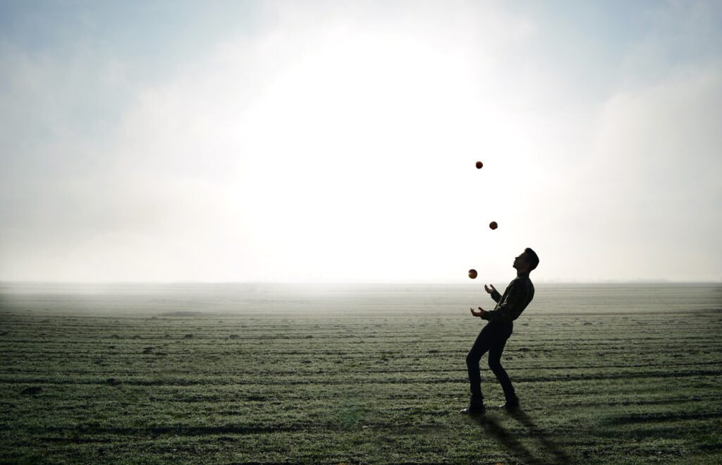 A man juggling balls as metaphor for Brian Dyson's speech on juggling the 5 balls of life